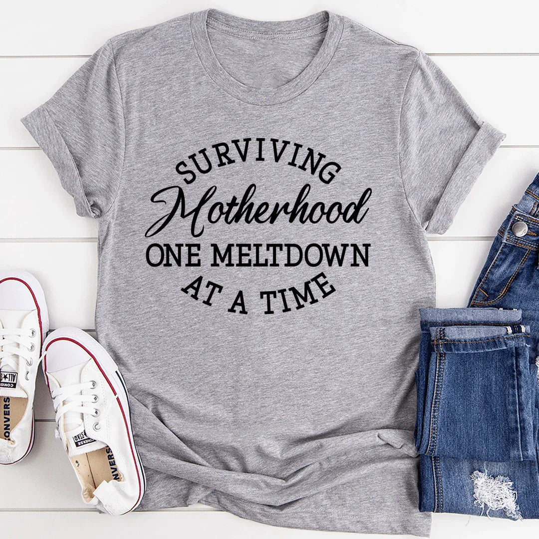 Relatable Mom Life Humor Graphic Tee – "Surviving product image 1